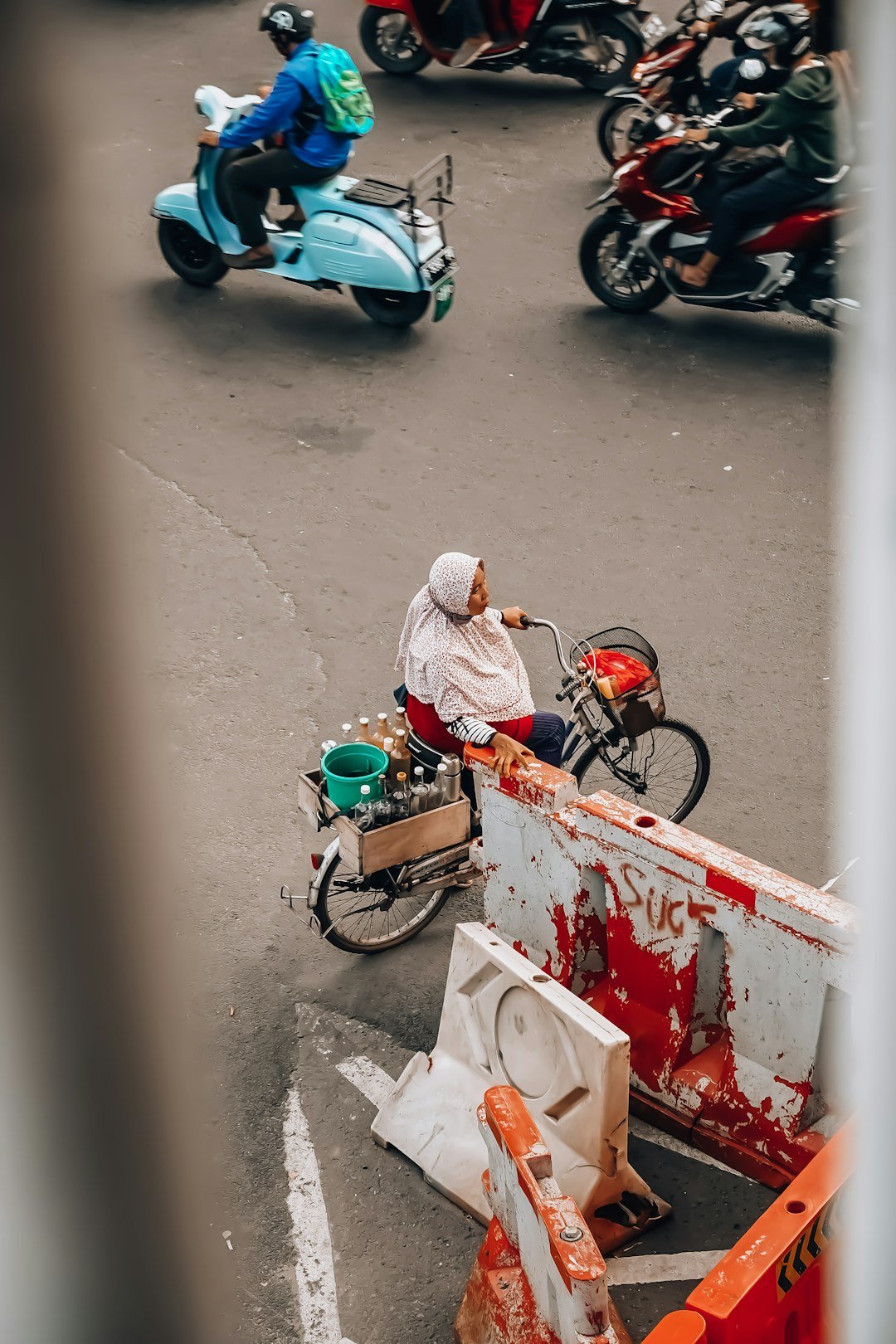 Woman on motorbike with drinks